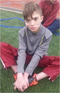 Christian smiling at soccer practice right before his birthday.