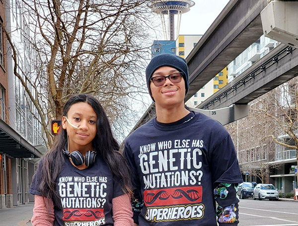 A woman and a man standing next to each other in downtown Seattle.