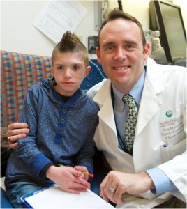 Christian with Dr. Birgfeld at Seattle Children’s before his second surgery.