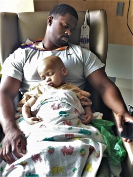 Dennis Williams holds Isaac while he undergoes treatment for stage 4 high-risk neuroblastoma at Seattle Children’s Hospital in 2019.
