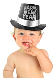 Adorable ten month old baby boy wearing a Happy New Year hat.