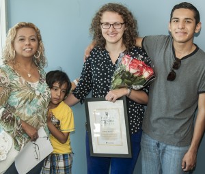 Jo Ristow (holding flowers) with Victoria Montalvo and her sons, Amado (in yellow) and Jairo.