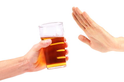 Hand rejects a glass of beer